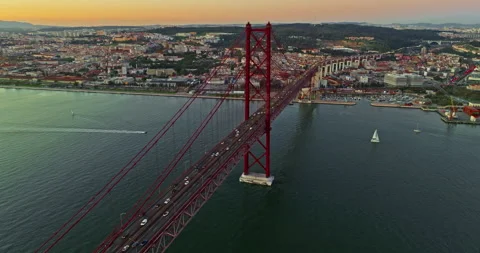 Aerial view of 25 de Abril bridge over the Tagus River at sunset in Lisbon 스톡 동영상 311802927