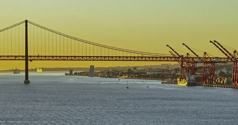 Aerial view of 25 de Abril bridge over the Tagus River at sunset in Lisbon 스톡 동영상 311804570