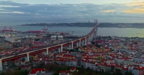 Aerial view of 25 de Abril bridge over the Tagus River at sunset in Lisbon Vídeos de archivo 317619554