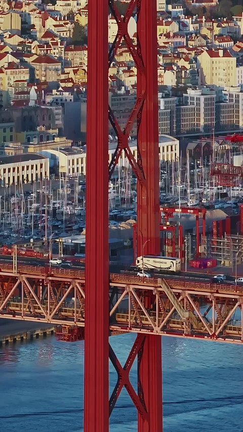 Aerial view of 25 de Abril bridge over the Tagus River at sunset in Lisbon Stock Footage 319966885