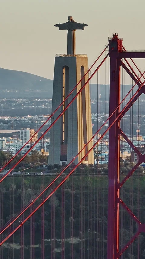 Aerial view of 25 de Abril bridge over the Tagus River at sunset in Lisbon Stock Footage 319967439