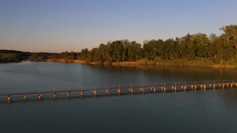 Aerial view of the 260-meter-long wooden causeway bridge to Mausinsel, a private Stock Footage 316622183