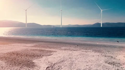 Aerial view of 3 massive wind turbines in the sea. Stock Footage 234703175