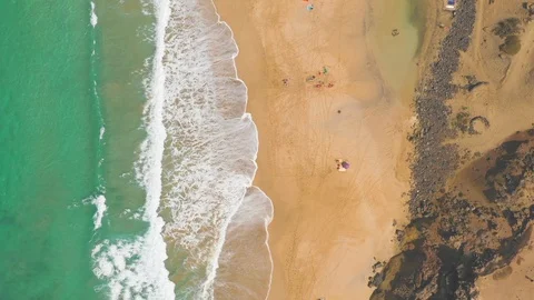 Aerial View 3 Of Ocean Waves and rock of Cotillo in Fuerteventura island Stock Footage 119588461