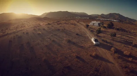 Aerial view of a 4 by 4 car in desert at sunset. Spain. 4k Stock Footage 44789663