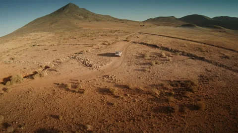 Aerial view of a 4 by 4 car crossing the desert. Spain. 4k Stock Footage 44789829