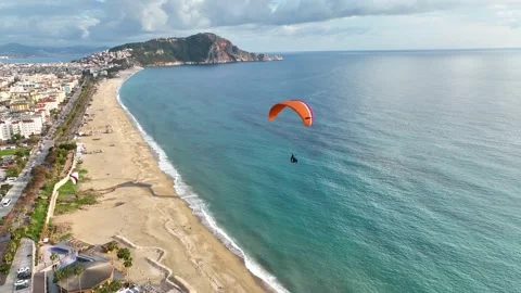 Aerial view 4 K parachute jumper flying over beautiful Alanya Stock Footage 209805837