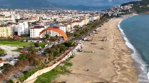 Aerial view 4 K parachute jumper flying over beautiful Alanya Stock Footage 209809062
