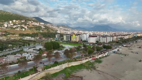 Aerial view 4 K parachute jumper flying over beautiful Alanya Stock Footage 224001645