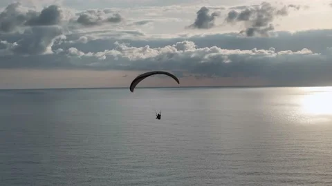 Aerial view 4 K parachute jumper flying over beautiful Alanya Stock Footage 224004014