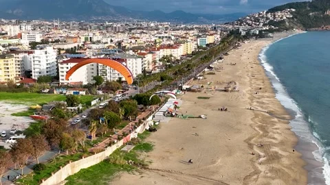 Aerial view 4 K parachute jumper flying over beautiful Alanya Stock Footage 224006274
