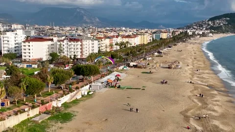 Aerial view 4 K parachute jumper flying over beautiful Alanya Stock Footage 224007306