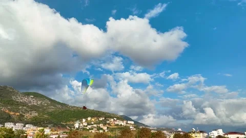Aerial view 4 K parachute jumper flying over beautiful Alanya Stock Footage 224007807