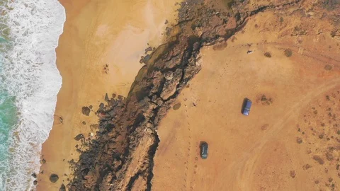 Aerial View 4 Of Ocean Waves and rock of Cotillo in Fuerteventura island Stock Footage 119588468