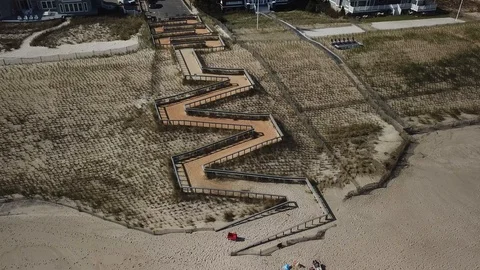 Aerial View 4K - Beach Path Zigzag - Backwards Revolving Stock Footage 118002562