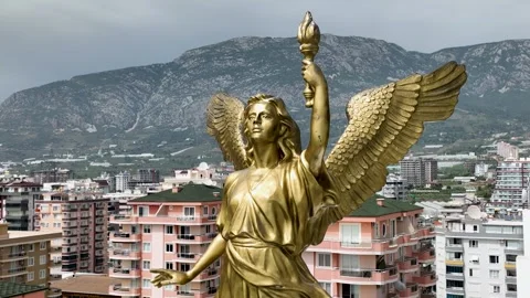 Aerial View 4K: Celestial Guardian - Golden Angel Overlooking the World Video stock 293451942