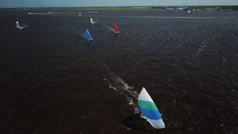 Aerial View 4K - E Scow Sailboats Sailing Downwind (BBYRA) - Approach Stock Footage 113144294
