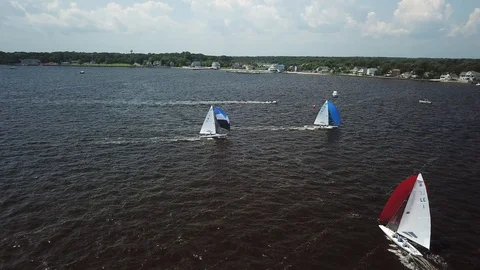Aerial View 4K - E Scow Sailboat Race on the Barnegat Bay (BBYRA) - Follow/Pan Stock Footage 113145386