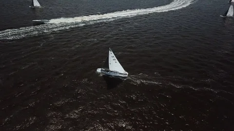 Aerial View 4K - E Scow Sailboats Crossing Boat Wake (BBYRA SS11) Stock Footage 113146464