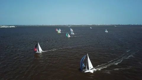 Aerial View 4K - E Scow Sailboats Racing Downwind with Spinnakers (BBYRA) Video stock 113146839
