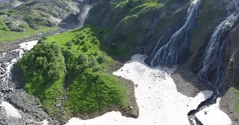 Aerial View. 4K flies over a beautiful waterfall and cliffs Stock Footage 73872437
