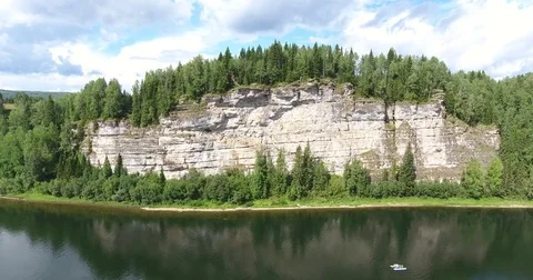 Aerial view. 4K flight along the cliffs above the river and catamaran Stock Footage 73936660