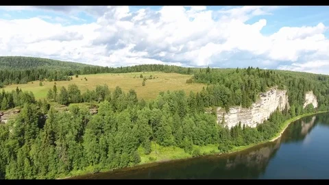 Aerial view. 4K flight along the cliffs above the river Stock Footage 73936898