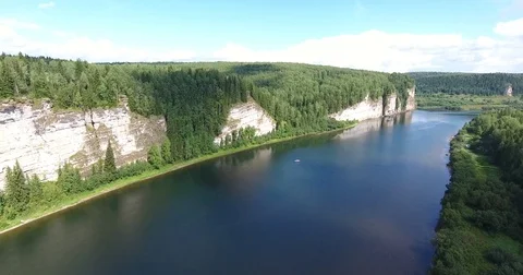 Aerial view. 4K flight along the cliffs above the river and catamaran Stockbeeldmateriaal 73988916