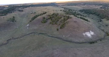 Aerial View. 4К Flight over the beautiful hills and forest Stock Footage 85558269