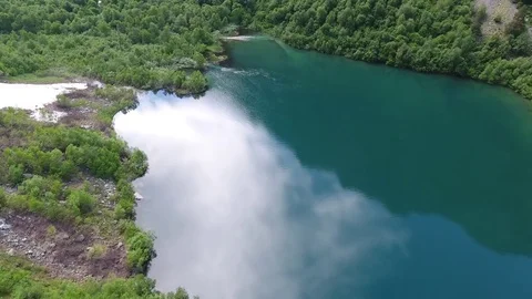 Aerial View. 4к Flying over the beautiful lake near mountains Stock Footage 73146178