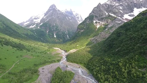 Aerial view .4K flying over the river to the mountains Stock Footage 73299863