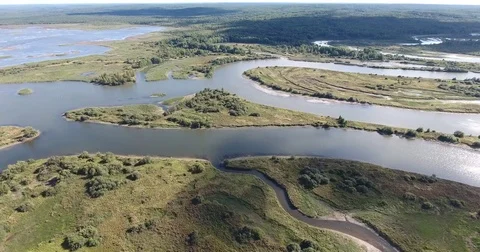 Aerial view .4K flying over the meandering river Stock Footage 73335558