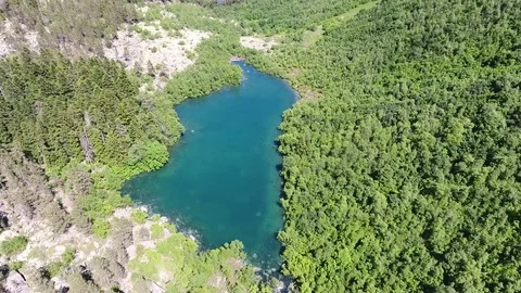 Aerial View. 4к Flying over the beautiful lake near mountains Stock Footage 73335801