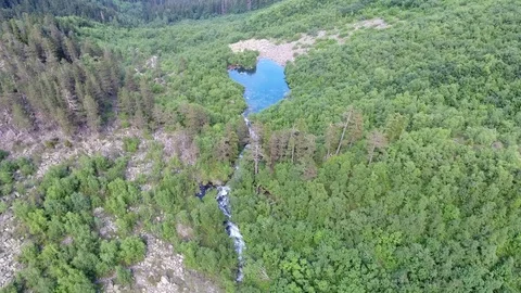 Aerial View. 4к Flying over the beautiful lake near mountains Stock Footage 73336028