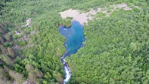Aerial View. 4к Flying over the beautiful lake near mountains Stock Footage 73383826