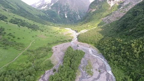 Aerial view .4K flying over the river to the mountains Stock Footage 73385189