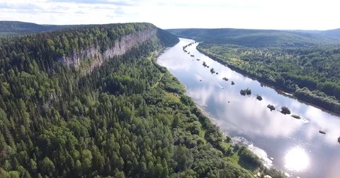 Aerial view. 4K flying over the river, forest and cliffs . The boat floats on Stock Footage 73506959