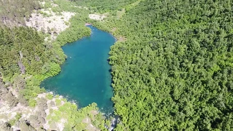 Aerial view. 4K flying over the mountain lake Stock Footage 73872650