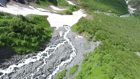 Aerial view .4K flying over a mountain stream Stockbeeldmateriaal 73984638