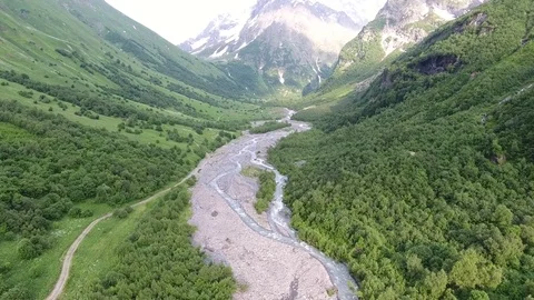 Aerial view .4K flying over the river to the mountains Stock Footage 74277282