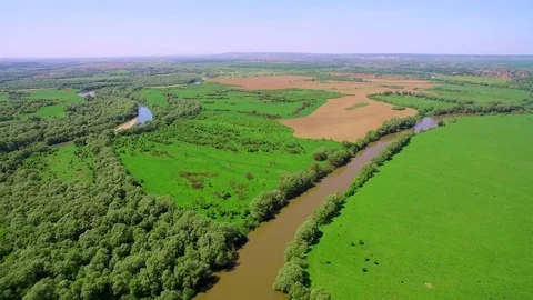 Aerial View 4k. Flying over the beautiful River. Aerial camera shot. Landscape Stock Footage 77044832