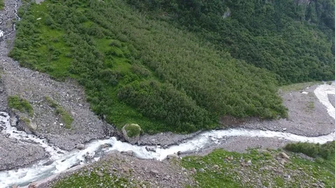 Aerial view .4K flying over a mountain stream Stock Footage 86815913