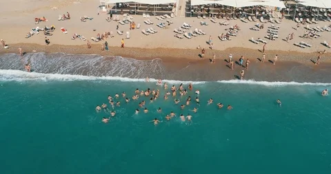 Aerial view in 4k. Large Group of friends having fun in the sea Stock Footage 101264311