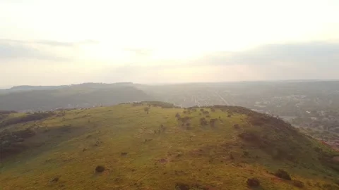 AERIAL VIEW: 4k  Magical drone footage of African mountain landscape next to urb Stock Footage 199617827