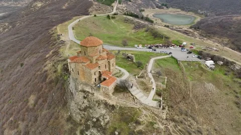 Aerial View 4K: Mtskhetas Majestic Cathedral - An Ancient Marvel by the River Stock Footage 293594138