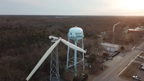 Aerial View 4K - Ocean Gate Defective Wind Turbines with Sunset - Backwards Video stock 125839818