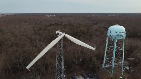 Aerial View 4K - Ocean Gate Defective Wind Turbine - Backward Reveal Stock Footage 125839850