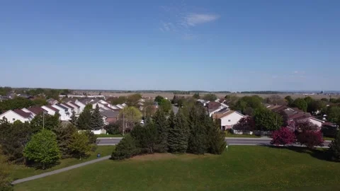 Aerial View 4K over an empty soccer field, tilt to suburbs Stock Footage 154459480