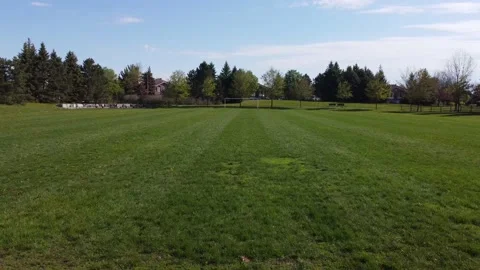 Aerial View 4K over an empty soccer field zoom Stock Footage 154459521