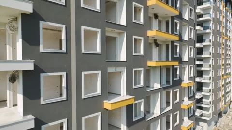 Aerial View 4K: Pillars of Progress - Varied Techniques in Building Homes Stock Footage 293519554